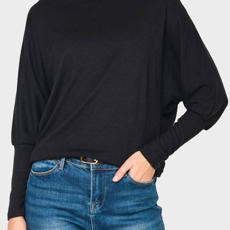Woman modeling Slouchy Luxe Open Neck Sweater in Black styled business casual