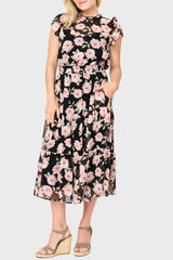 Woman modeling Sweetheart Pin Dot Flutter Sleeve Dress in Black Pink Floral styled business casual for work