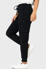 Side of women wearing the Gigi Essential Soft Ponte Cargo Jogger in black