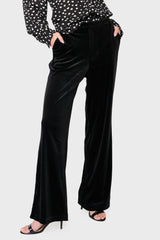 Woman modeling Lindsey Velvet Pant in Black styled business casual for holiday