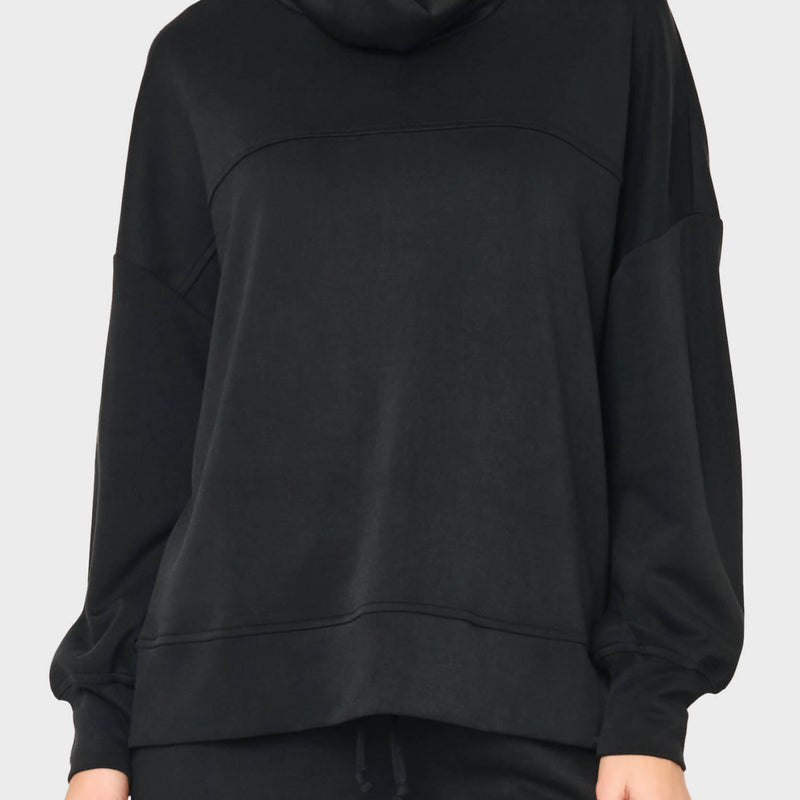 woman modeling Cloud Scuba Mock Neck Everywhere Top styled with matching pant for lounging and travel