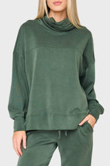 woman modeling Cloud Scuba Mock Neck Everywhere Top in green styled as matching set for lounging and weekends