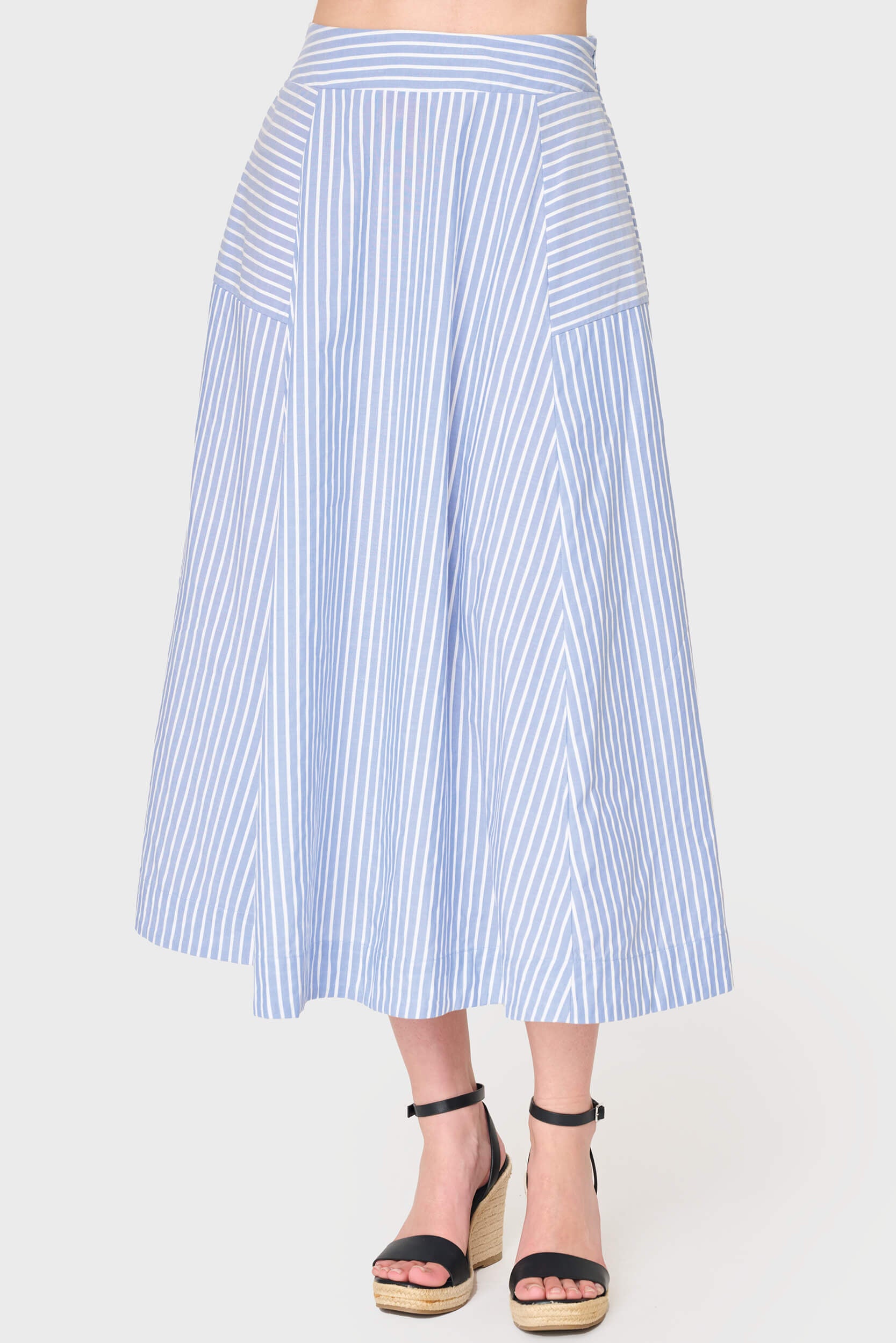 Woman modeling Amanda Smocked Back Midi Skirt in blue white stripe styled for work and weekends