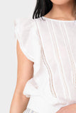 Close-up of women wearing Elan Ruffle Sleeve Detail Smocked Blouse in white