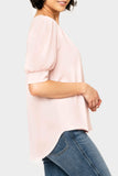 Side of women wearing the Puff Sleeve V-Neck Blouse in light dusty pink