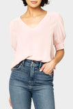 Front of women wearing the Puff Sleeve V-Neck Blouse in light dusty pink
