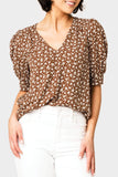 Front of women wearing the Puff Sleeve V-Neck Blouse in saddle ivory floral