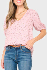 Woman modeling Avery Elbow Sleeve Top in pink floral print styled business casual