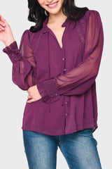 Woman modeling Long Sleeve Crochet Trim Blouse in Deep Plum purple styled business casual
