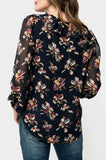 Back of Woman wearing GIGI Blouson Sleeve V-Neck Top with Ruffle Trim in Navy Blossom Print