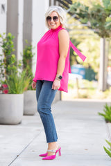 Front of Woman wearing Smocked Neck Chiffon Shell with Detachable Tie in Hot Pink