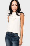 Front of Woman wearing Smocked Neck Chiffon Shell with Detachable Tie in Cream