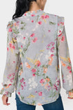 Back of Woman wearing Long Sleeve Ruffle Trim V-Neck Blouse in Dusky Blue Grey Floral Print