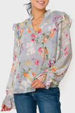 Front of Woman wearing Long Sleeve Ruffle Trim V-Neck Blouse in Dusky Blue Grey Floral Print