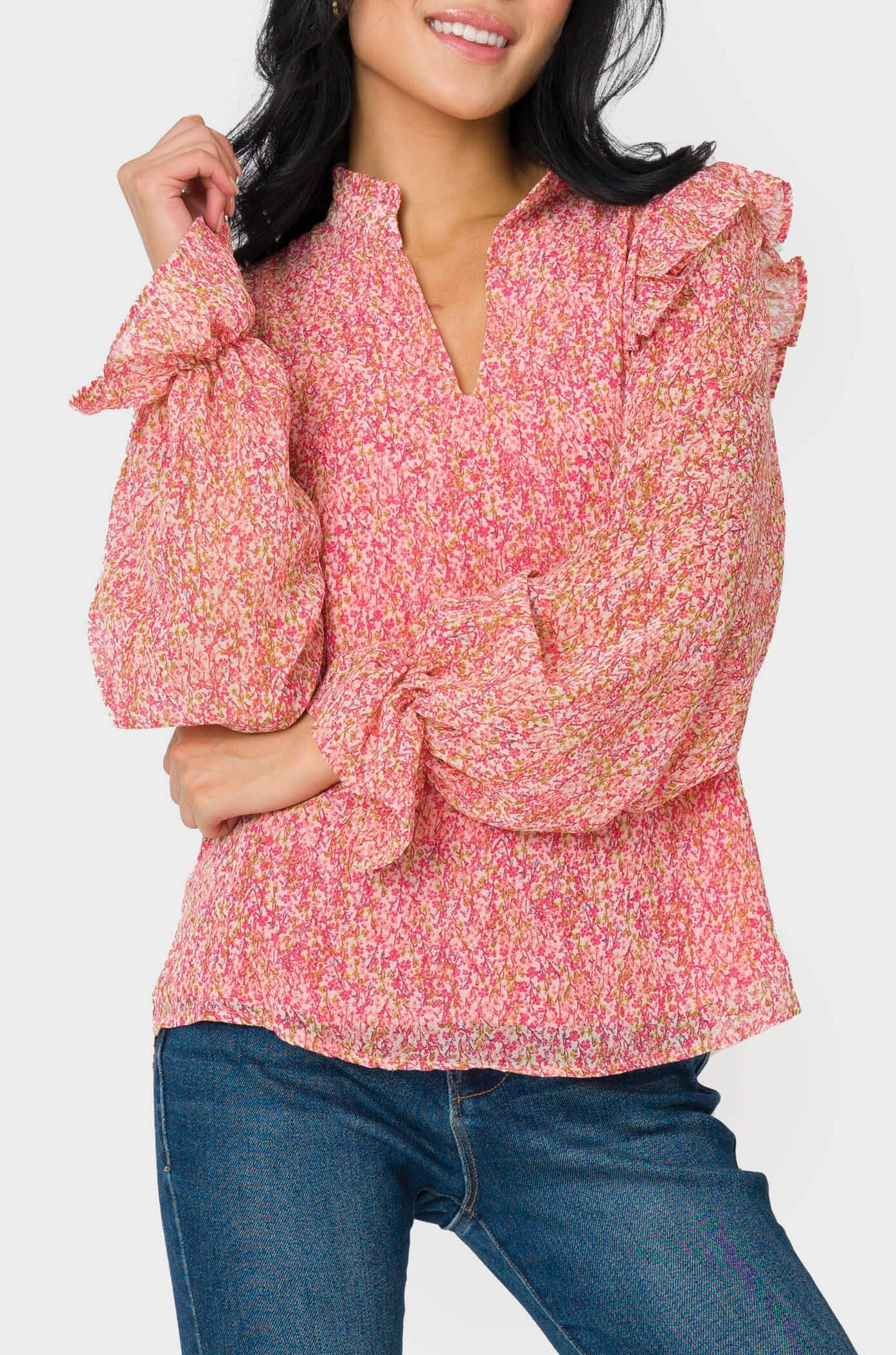 Front of Woman wearing Long Sleeve Ruffle Trim V-Neck Blouse in Pink Mini Floral