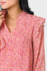 Close-up of Front of Woman wearing Long Sleeve Ruffle Trim V-Neck Blouse in Pink Mini Floral Print