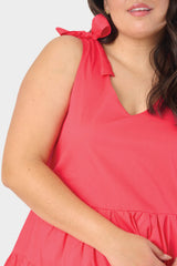 Close-up of Woman wearing Coral Poppy V-Neck Tiered Dress with Shoulder Ties