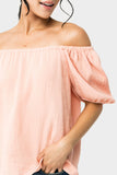 Close-up of Front of Woman wearing Dusk To Dawn Off Shoulder Top in Sunset Coral
