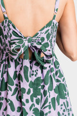 Back of Women Wearing Carmen Smocked Tie-back Maxi Dress in Peri Green Potager Print