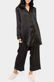 Front of Woman wearing GIGI Luxe Lounge Silky Sleep Pant in Black