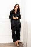 Front of Woman wearing GIGI Luxe Lounge Silky Sleep Pant in Black