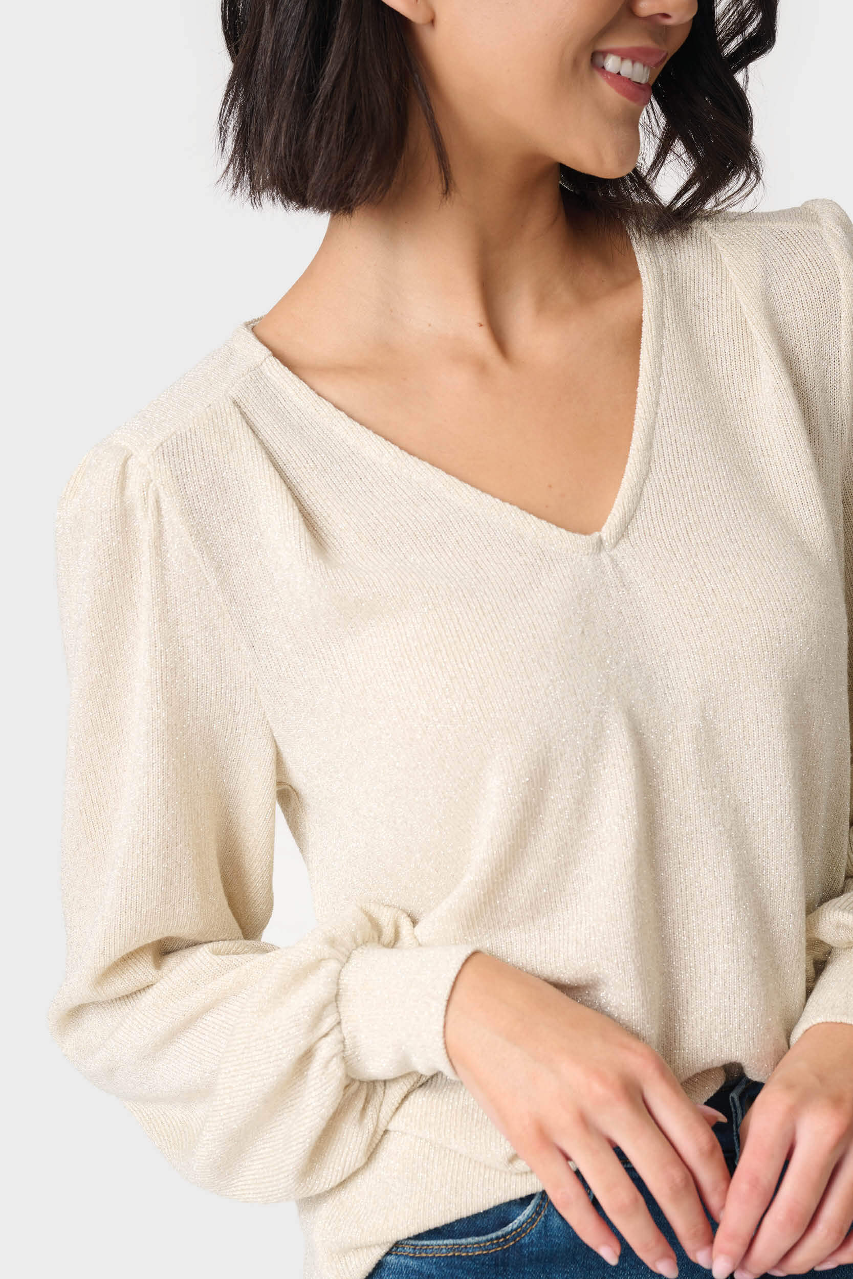 Close up picture of a Woman wearing V-Neck Blouson Sleeve Shimmer Top in Oyster