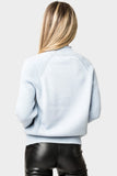 Back of Woman wearing Raglan Sleeve Mixed Media Mock Neck Sweater in Apres Light Blue
