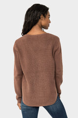Back of Woman wearing V-Neck Ribbed Relaxed Sweater in Cinnamon