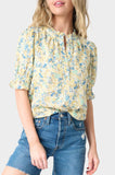Front of Woman wearing Yellow Blue Flax Dianthus Henley Puff Sleeve Blouse