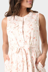 Close-up of Woman wearing Floral Wildflower Blouson Sleeveless Belted Tiered Dress
