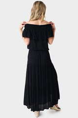 Back of Woman wearing Black Tiered Maxi Skirt With Offset Front Slit