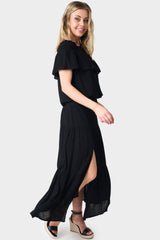 Side of Woman wearing Black Tiered Maxi Skirt With Offset Front Slit