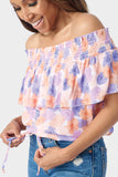 Close-up of Woman wearing Floral Off Shoulder Blouse with Drawstring