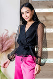 Front of Woman wearing Surplice Wrap Top with Organza Dot Sleeve in Black