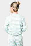 Back of Woman wearing Serene Mornings Henley Top in Mimosa Stripe