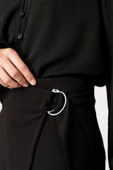 Close-up of Woman wearing Wrapped Up Skirt with Buckle in Black