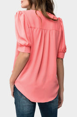 Back of Woman wearing Puff Sleeve V-Neck Blouse in Coral