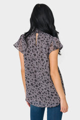Back of Woman wearing Flutter Sleeve Smocked Neck Blouse in Shadow Charcoal Flower