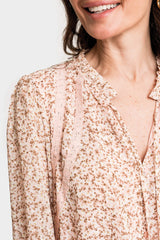 Close Up of Women Wearing Long Sleeve Crochet Trim Blouse in Pink Ditsy Floral