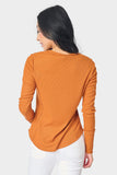 A Back Picture of a Woman wearing a Thermal Long Sleeve Henley Tee, Rust